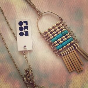 Long golden BoHo necklace by Romolo